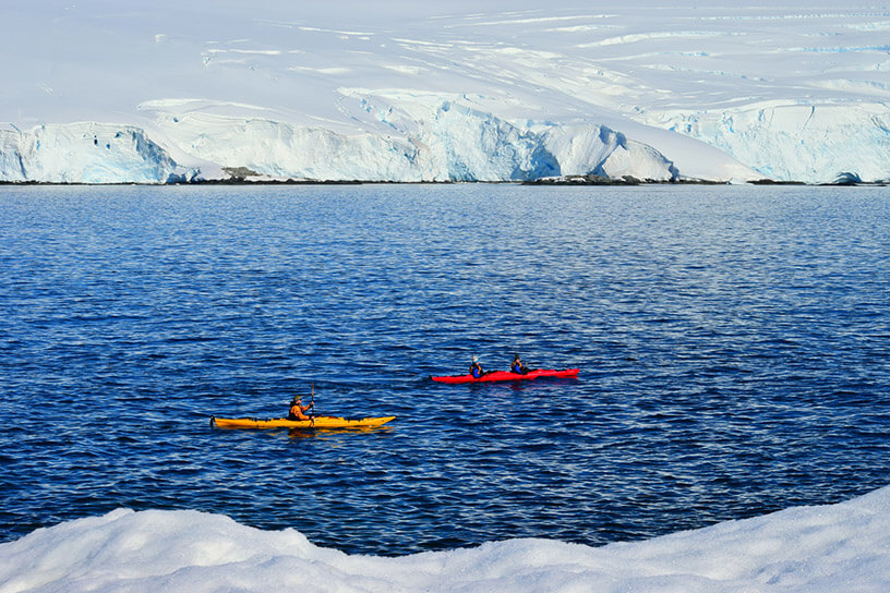 Kayaking on the blue ocean water 