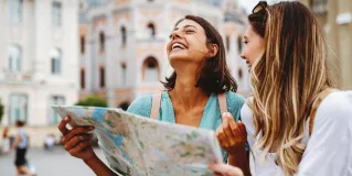 Two girls with a map 