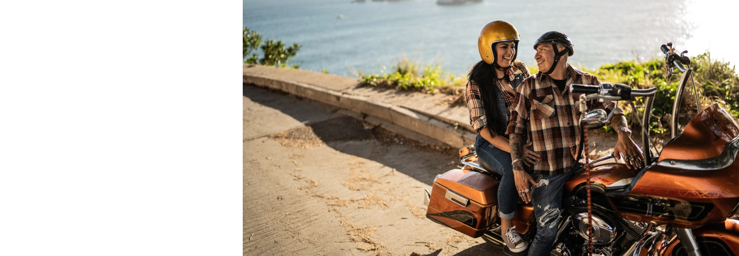 Couple exploring destination on motorbike