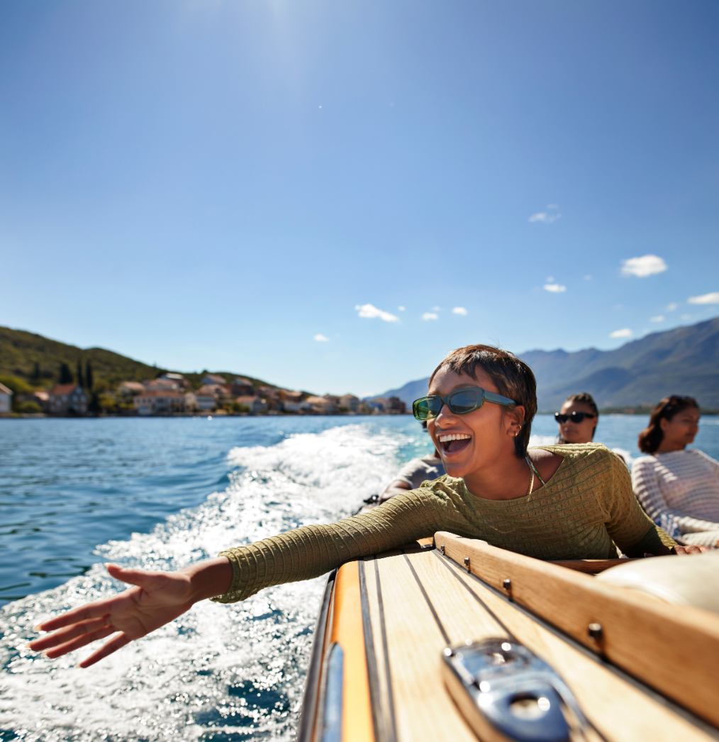 Woman with hand out of boat