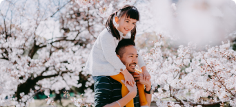 Dad and daughter enjoying cheery blossom season in Japan