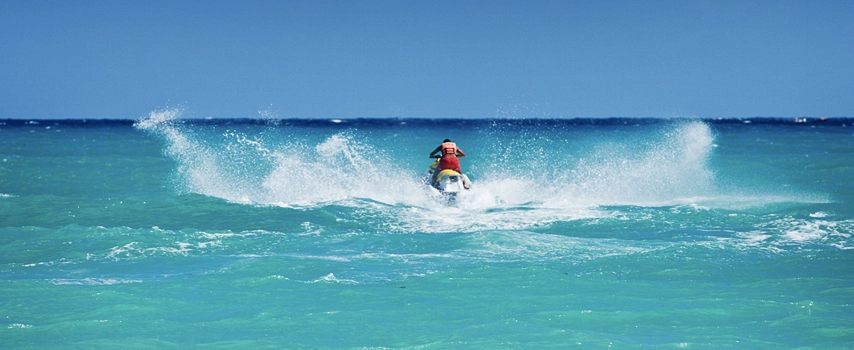 man riding jet ski in ocean