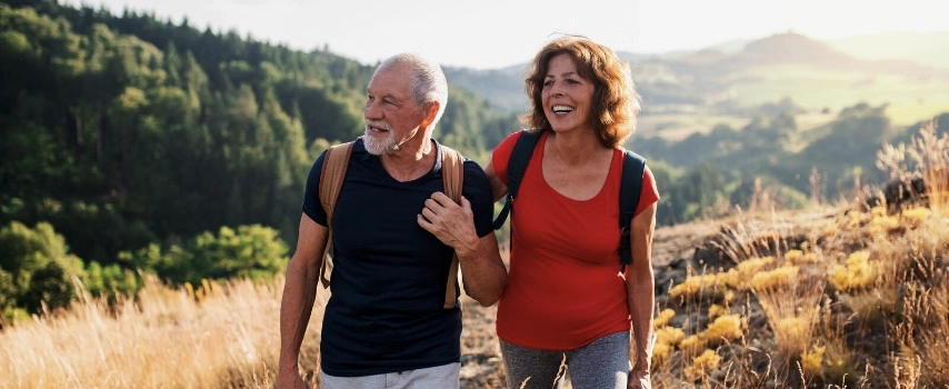 Senior couple hiking on holiday