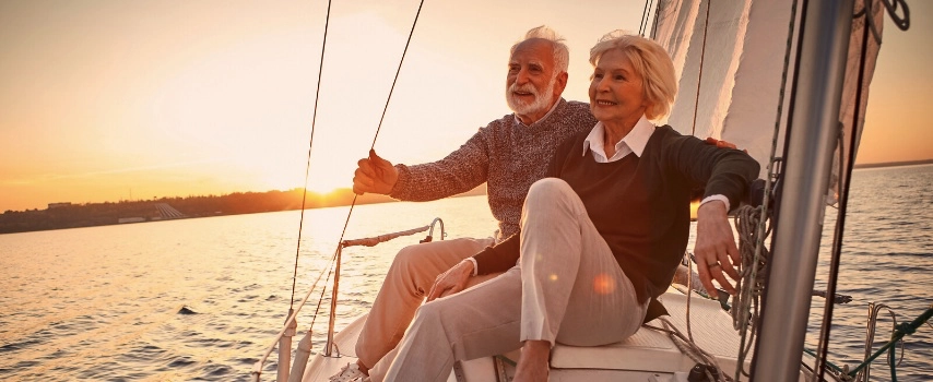 Happy senior couple on a boat on holiday