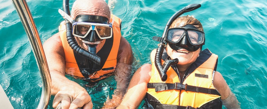 Senior couple snorkelling in Thailand