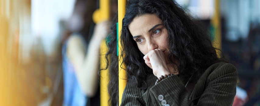 Anxious woman travelling on bus