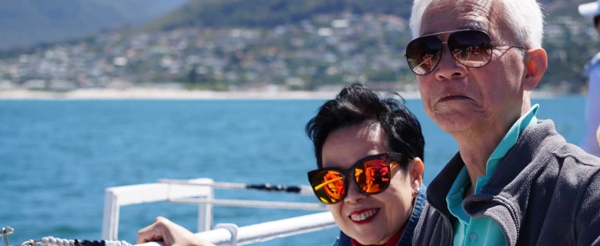 Asian senior elderly couple on tourist ferry boat