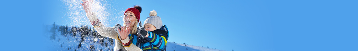 mother and son playing in snow