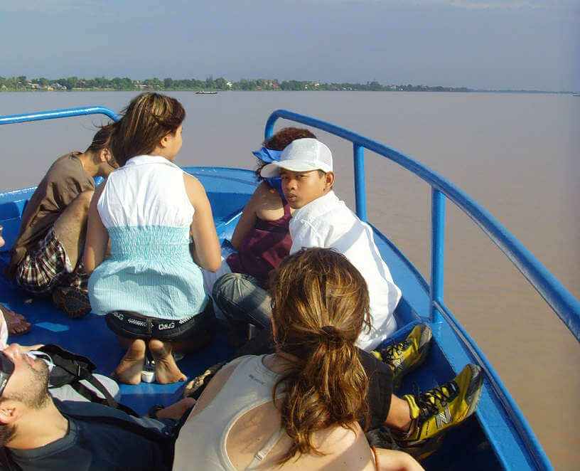Photo of kids on a boat in Cambodia