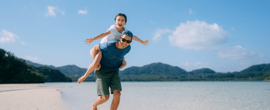 Dad and daughter at beach on island