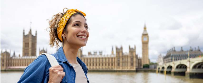 Woman with travel insurance for UK exploring London