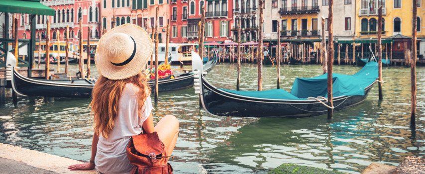 Girl ticking off travel bucket list in Venice