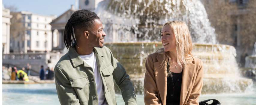 Couple relaxing at Trafalgar Square in the UK