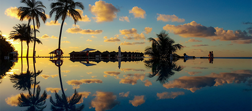 maldives-sunset-over-palm-trees