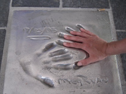 Photo of hand in a concrete hand mold