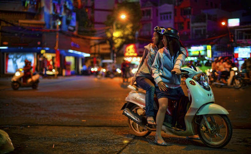 Two Vietnamese girls on a moped