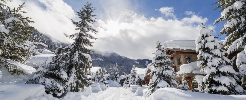 Ski lodge surrounded by snowy mountains