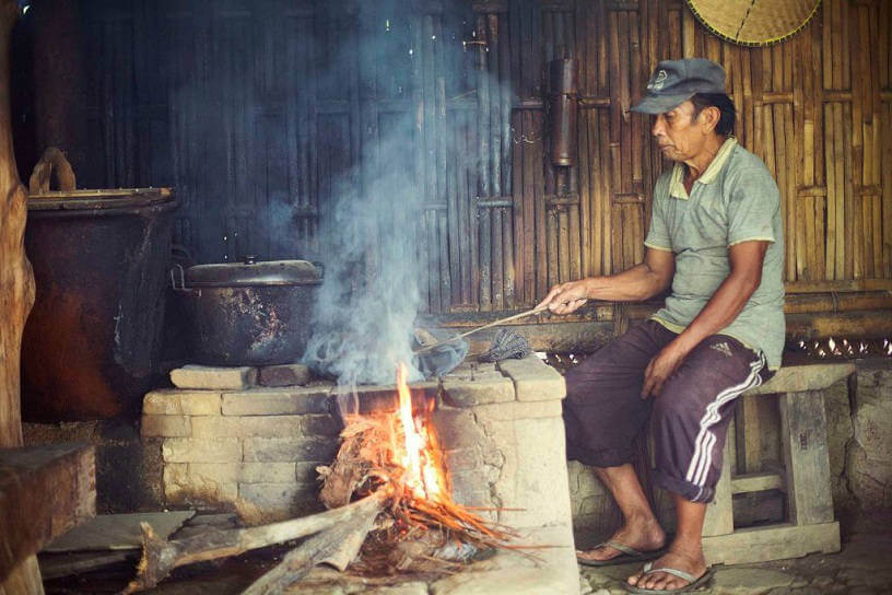 Man roasting coffee beans in Bali