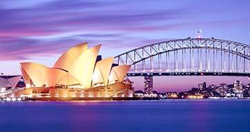 Sydney harbour bridge and opera house at dusk