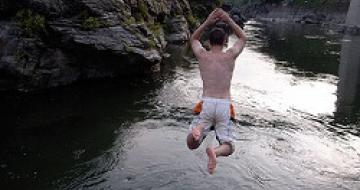 Thumbnail image of man jumping off rock into water at Nagatoro, Japan