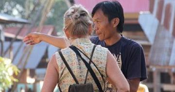 Thumbnail image of Indonesian man giving a lady directions