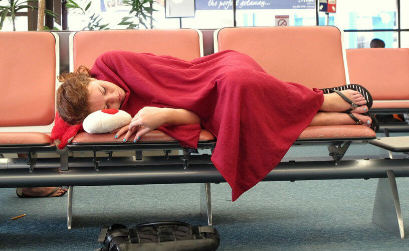 Lady asleep at the airport
