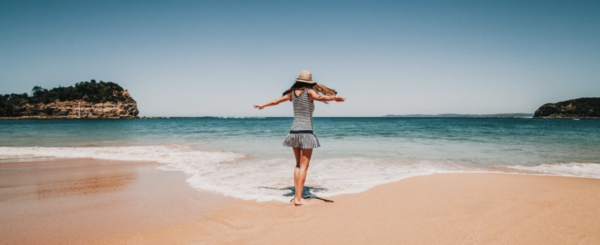 Woman dancing on beach in Australia