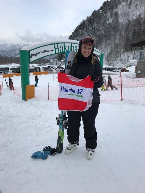 Woman standing in snow at Hakuba 47