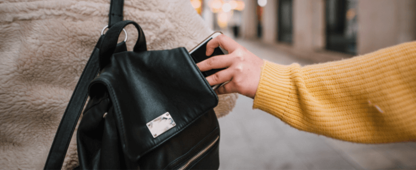Woman stealing phone from backpack